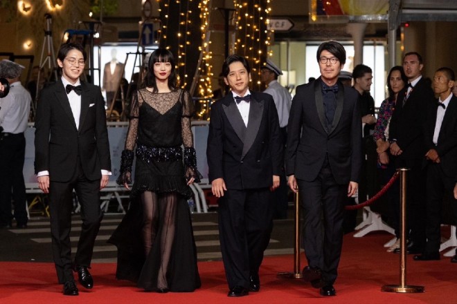 The Exit 8 team walks the red carpet at the 78th Cannes Film Festival